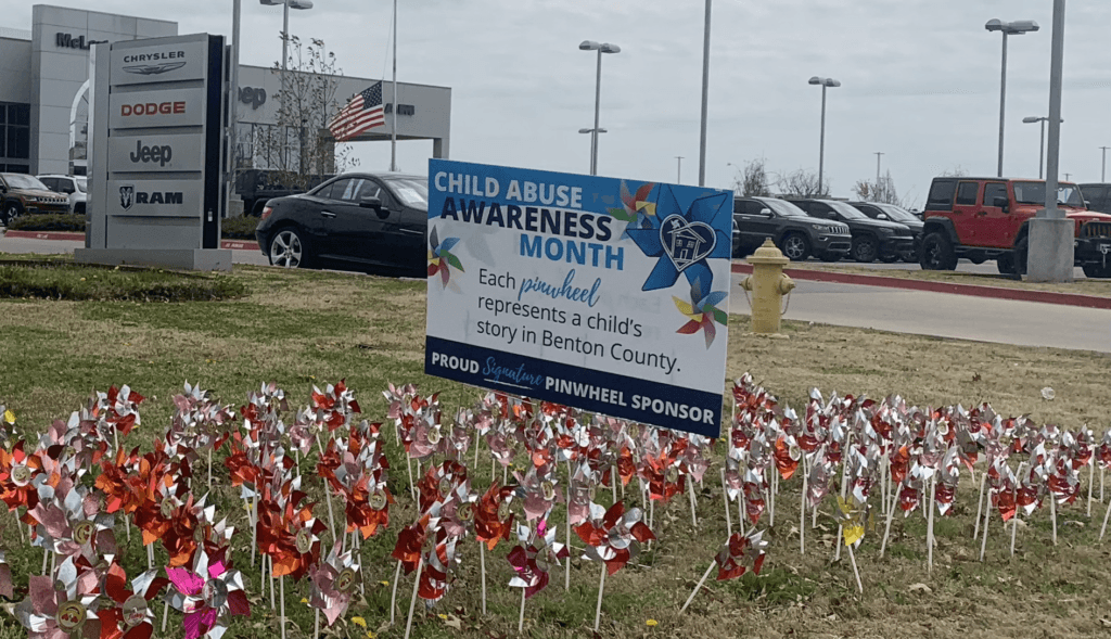Mclarty Daniel displays pinwheels outside of Chrysler Dodge Jeep Ram dealership in Bentonville.