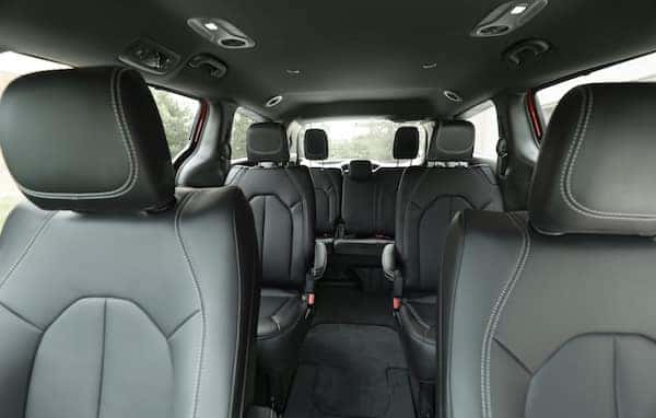 Black Caprice leatherette seats trimmed in Light Diesel stitching inside Chrysler Voyager van