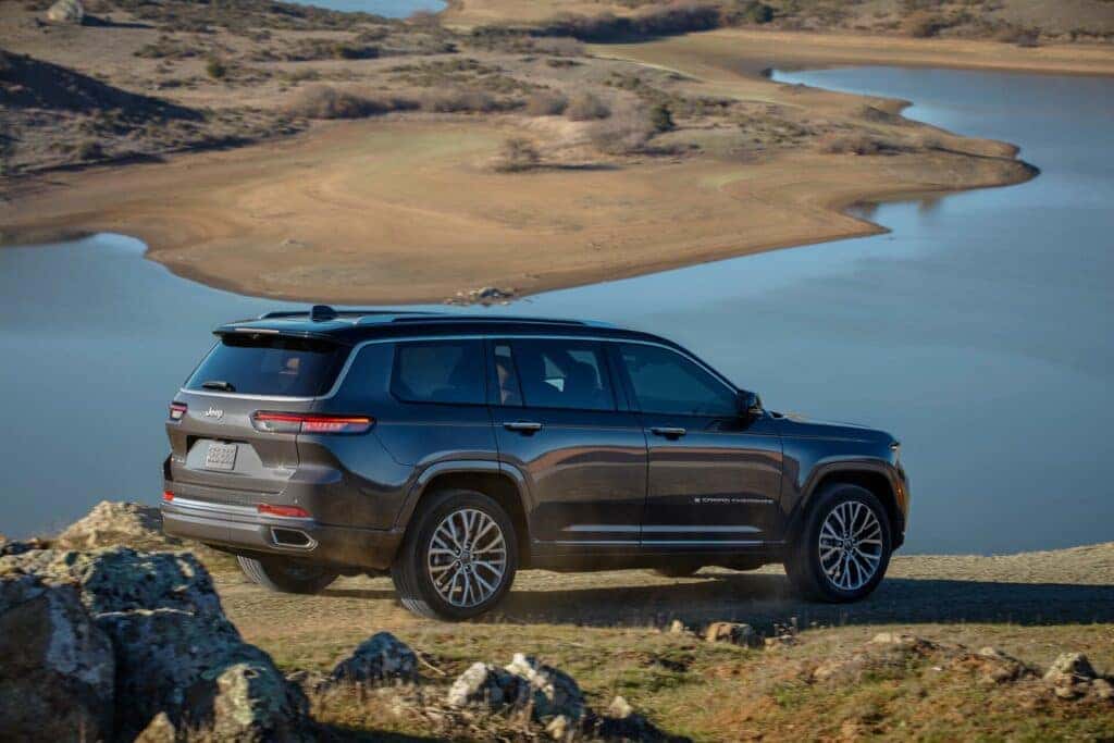 2025 Jeep Grand Cherokee overlooking water.