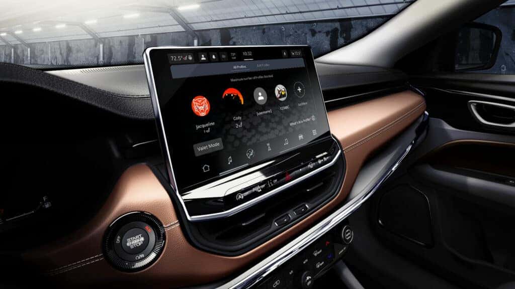The interior of the 2025 Jeep Compass, showing the infotainment screen.