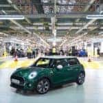 Green MINI Copper Hard Top 2 Door inside of a factory.
