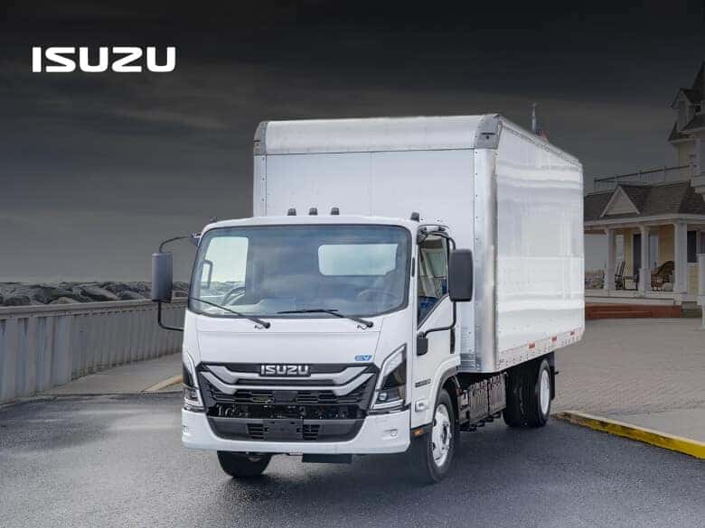 Isuzu NRR EV showcasing the LED headlight and EV badge.