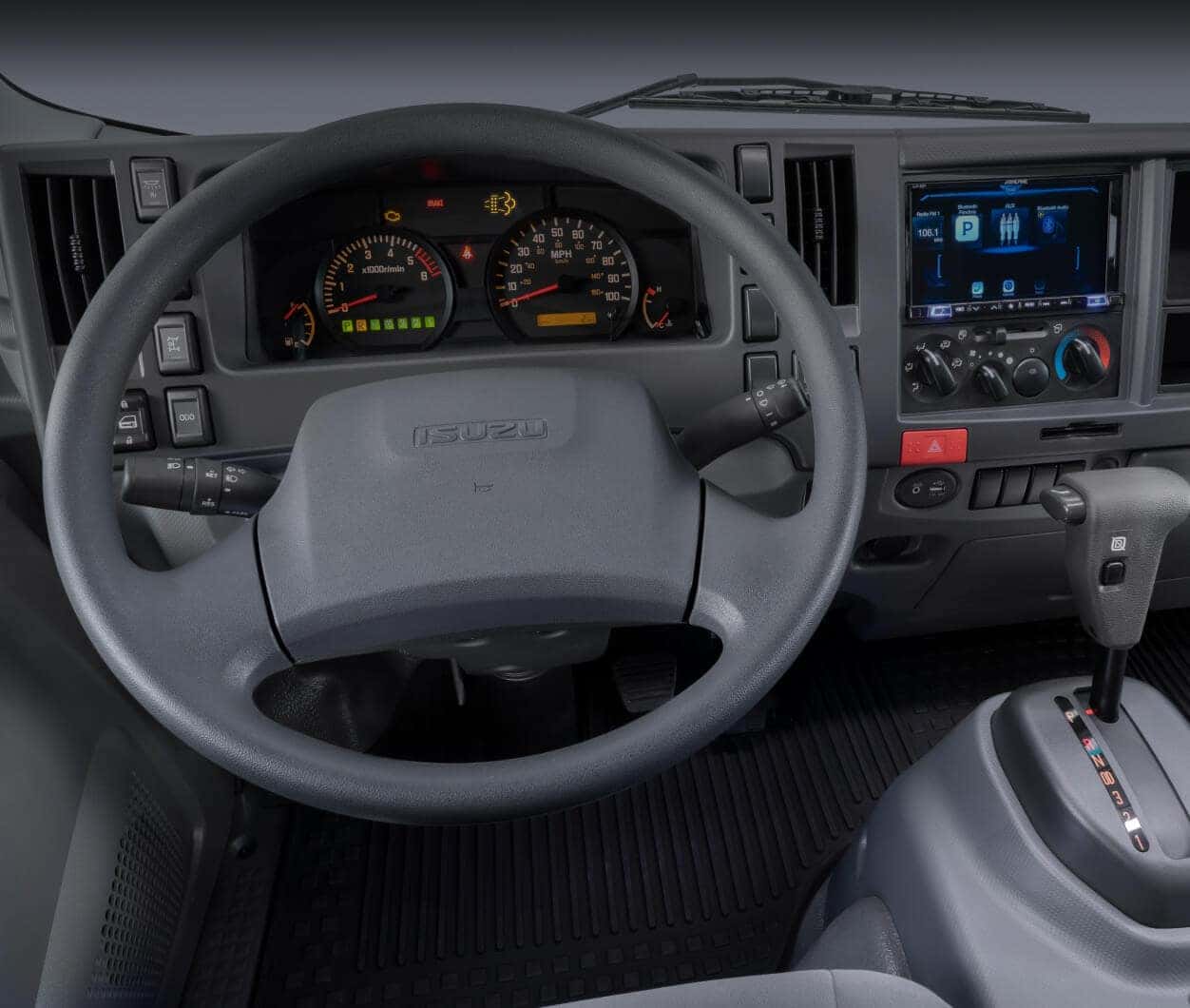 Isuzu NRR Diesel dashboard layout with touchscreen in a studio vehicle.