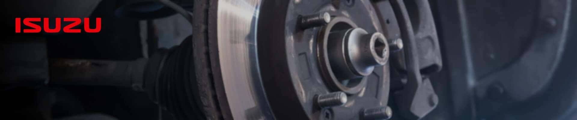 Close-Up of a brake pad with the Isuzu logo prominently shown.