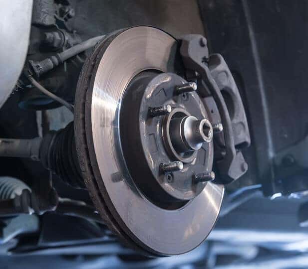 Close-Up of a brake pad with the Isuzu logo prominently shown.