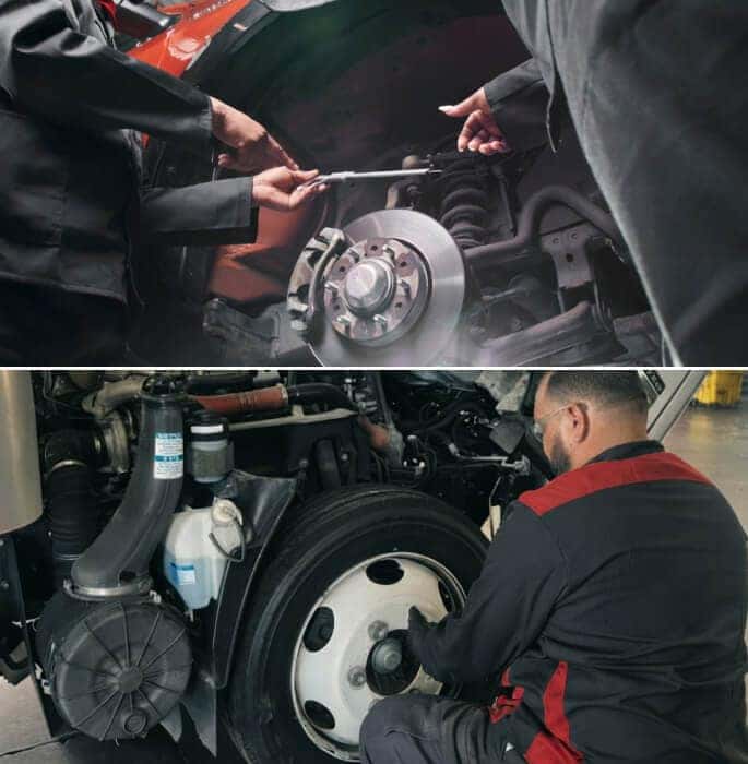 Two men use a caliper to check a brake rotor. A man removes an Isuzu wheel from the rotor.