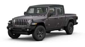 A dark gray 2020 Jeep Gladiator facing left on white