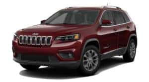 A burgundy 2020 Jeep Cherokee is facing left.