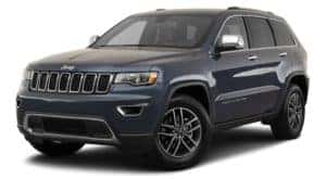 A blue 2020 Jeep Grand Cherokee is facing left.