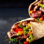 Two burritos are shown on a black background.
