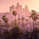 The hazy, pink skyline of Los Angeles at sunrise is shown, which isn't too far from our Costa Mesa, CA, Jeep dealership.
