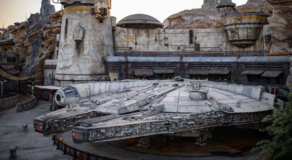 The Millennium Falcon is shown in front of the Star Wars Galaxy's Edge display in Orange County, CA.