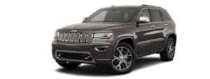 A dark grey 2020 Jeep Grand Cherokee is angled left.
