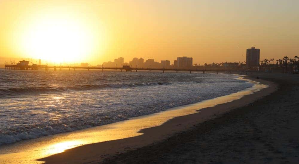 Alamitos Beach is shown at sunset.