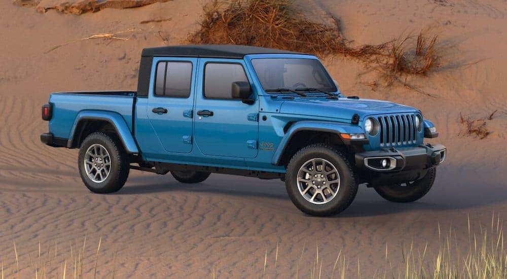 A blue 2021 Jeep Gladiator 80th Anniversary is shown angled right in the desert after leaving a Jeep dealership near you.