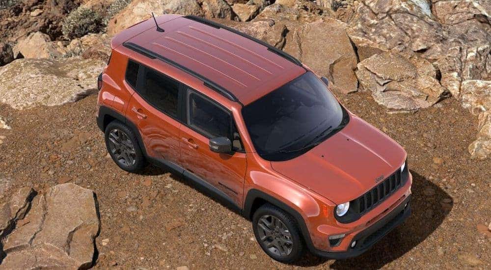 An orange 2021 Jeep Renegade 80th Anniversary is shown from the top and parked in the desert.
