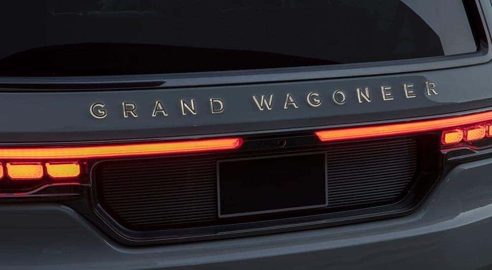 The illuminated badge and tails lights are shown on the 2021 Jeep Grand Wagoneer.