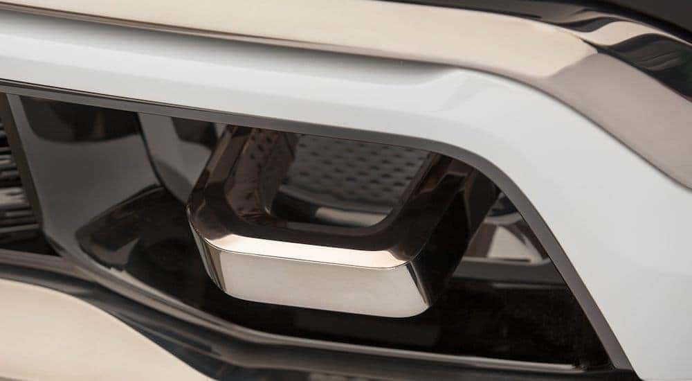The reintroduced Jeep model, the 2021 Jeep Grand Wagoneer, is shown with a close up of the chrome tow hook.
