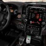 The black and red interior and infotainment system is shown on the 2021 Ram 1500 TRX.