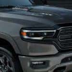 A closeup shows the hood on a gray 2021 Ram 1500 diesel at a Southern California diesel truck dealer.
