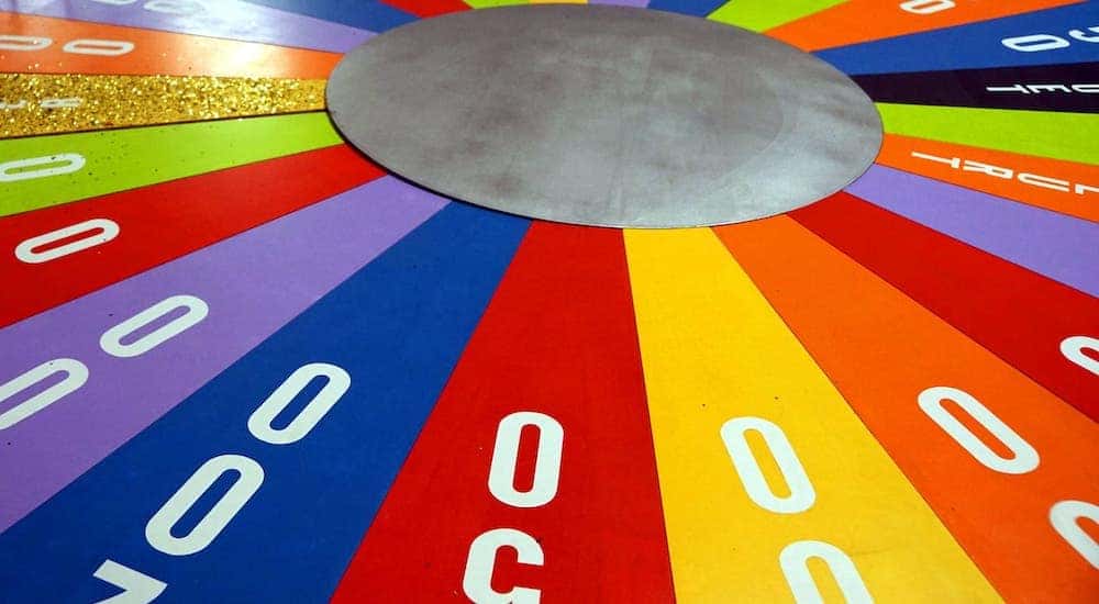 A closeup shows the colorful wheel from Wheel of Fortune.