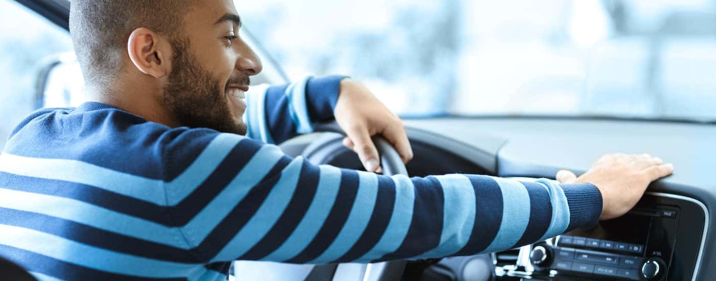 A person is shown shopping for a used truck near you.