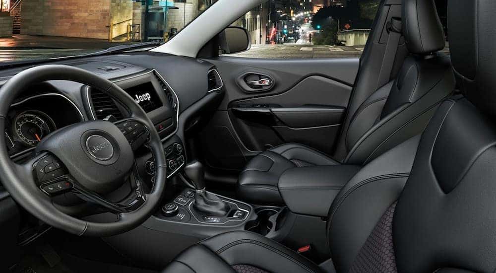 The black interior of a 2021 Jeep Cherokee is shown.