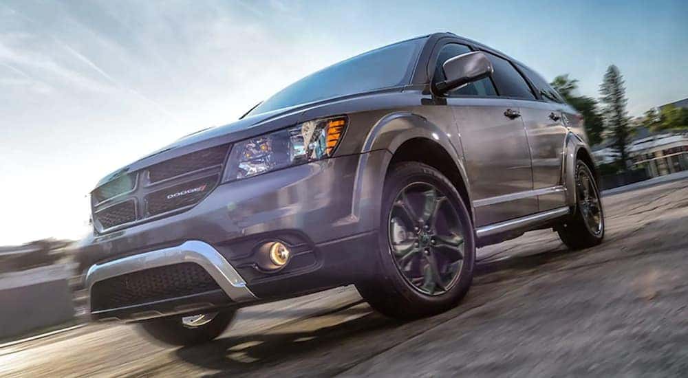 A grey 2020 Dodge Journey is shown on a sunny day.