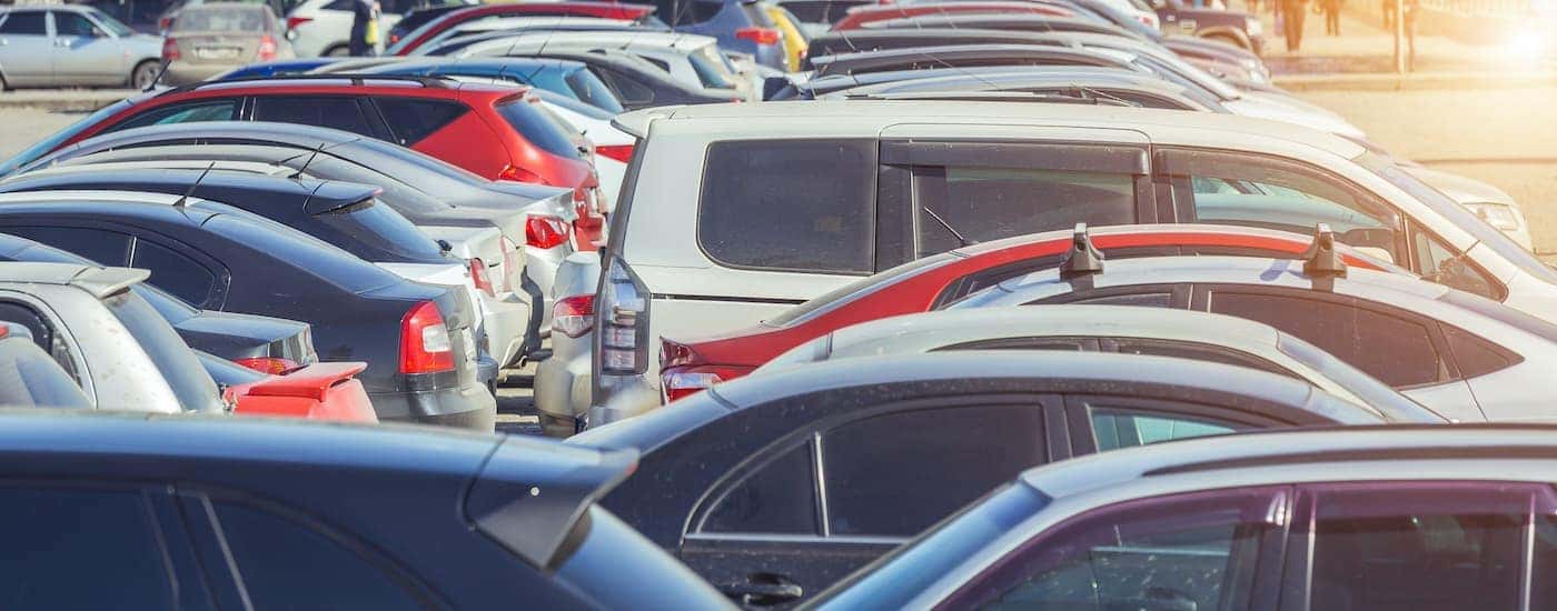 A used car lot is shown during the day.