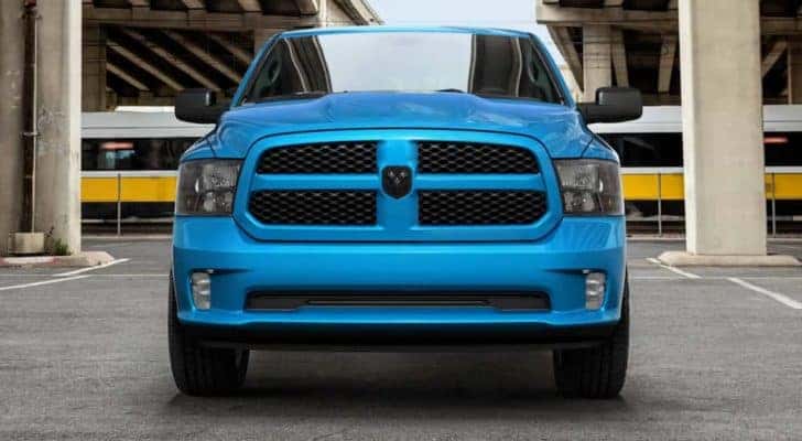 A blue 2020 Ram 1500 is shown from the front in a parking garage after leaving a LA used truck dealership.