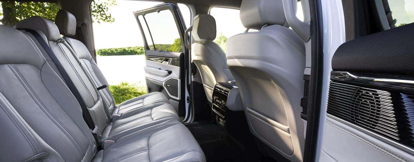A white interior of a 2022 Wagoneer shows the back row of seats.