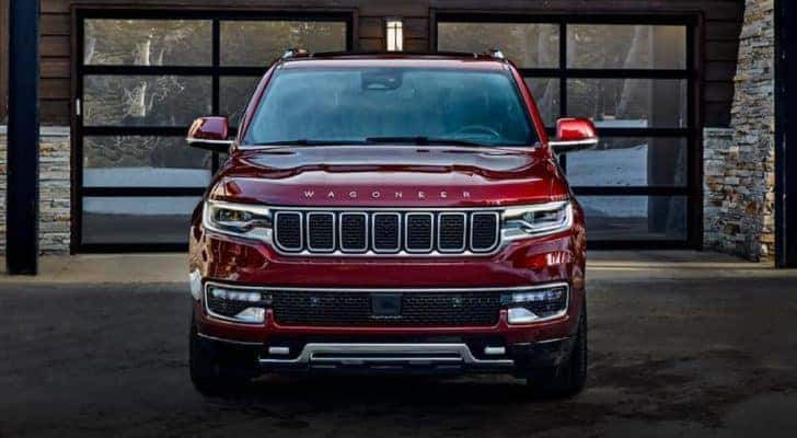 A red 2022 Wagoneer is shown from the front after leaving a LA Wagoneer dealership.