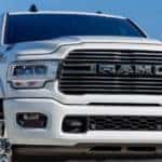 A close up of the front of a white 2021 Ram 2500 Laramie is shown.