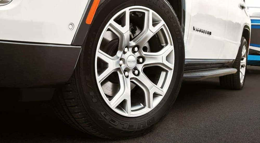 A close up shows the tire and rim of a white 2022 Wagoneer at a California Wagoneer dealer.