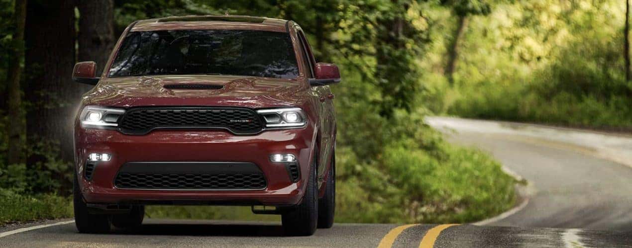 A red 2022 Dodge Durango is shown from the front driving on an open road.