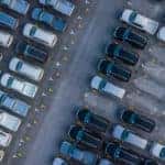 A used car lot is shown from a high angle.