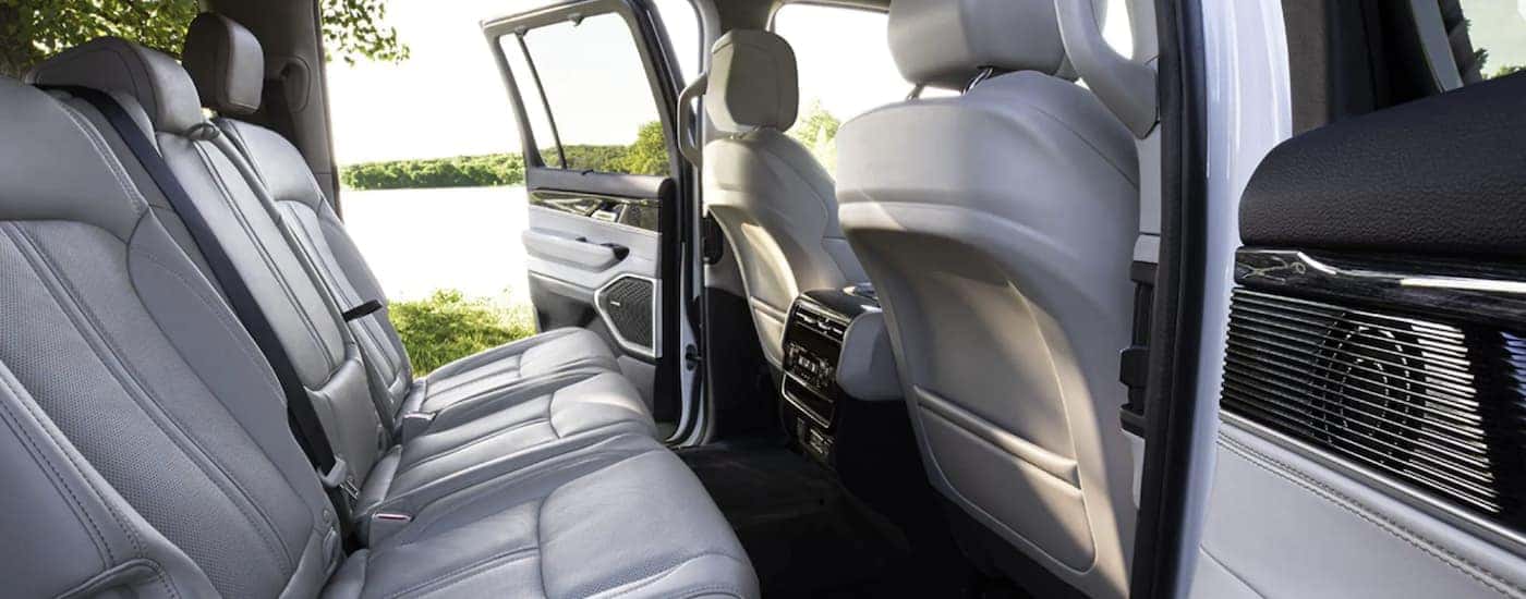 The white interior of a 2022 Wagoneer shows a row of seating.