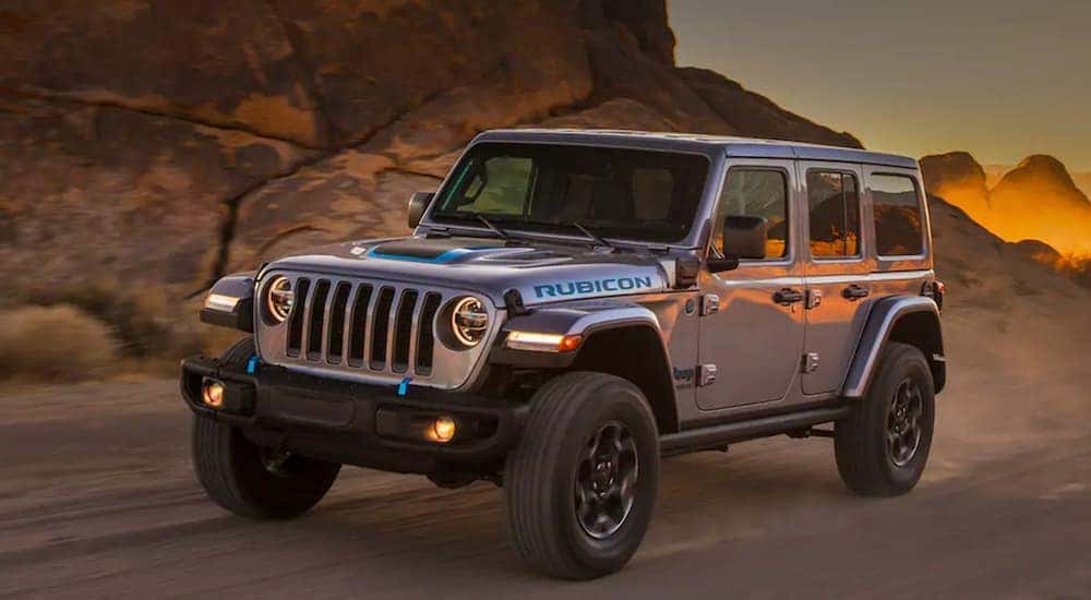 A 2021 Jeep Wrangler 4xe is shown from the front at an angle after the owner searched 'off road vehicle sales'.