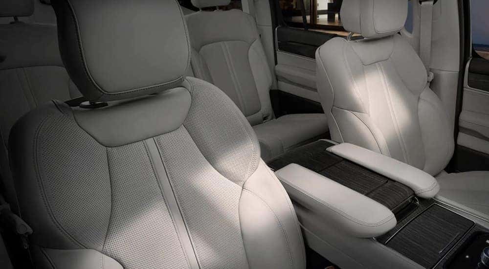 The white interior of a 2022 Wagoneer shows two rows of seating at a California Wagoneer dealer.