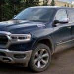 A blue 2022 Ram 1500 is shown from the front after getting a Ram truck lease.