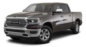 A grey 2023 Ram 1500 is angled left.