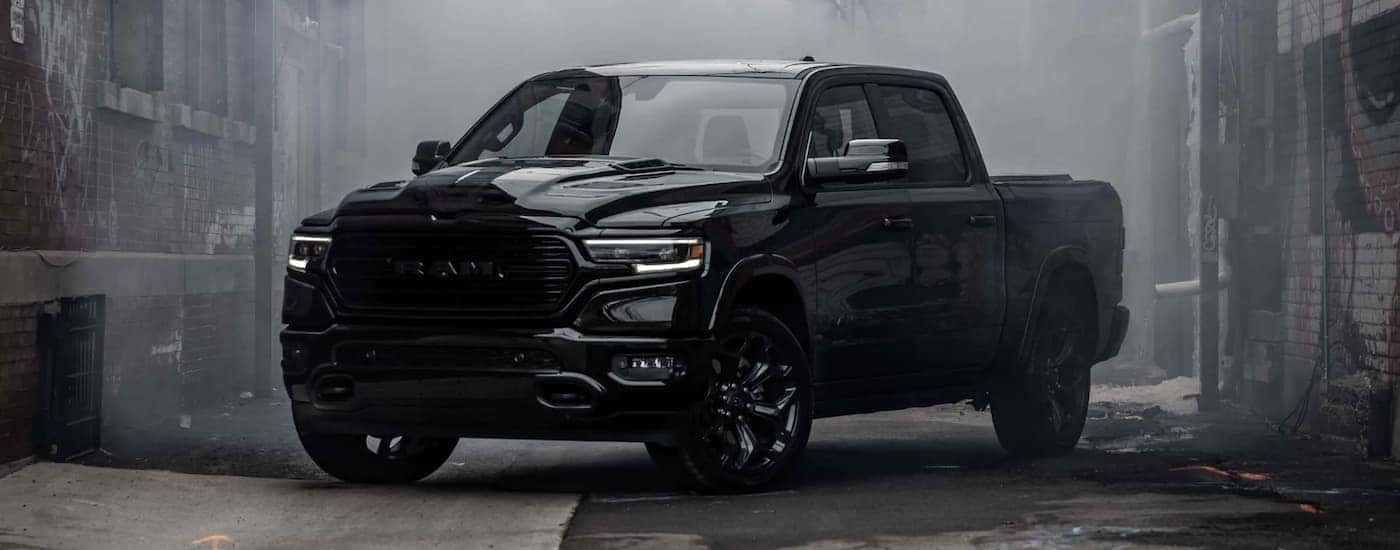 A popular Ram 1500 for sale, black 2023 Ram 1500 is shown parked in a city street.