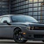 A grey 2018 Dodge Challenger is shown from the side.