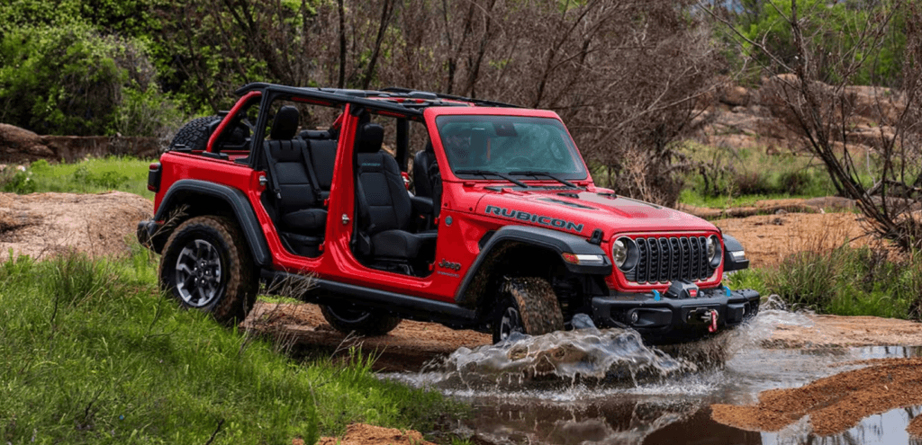 2025 Jeep Wrangler being driven through a stream off-road