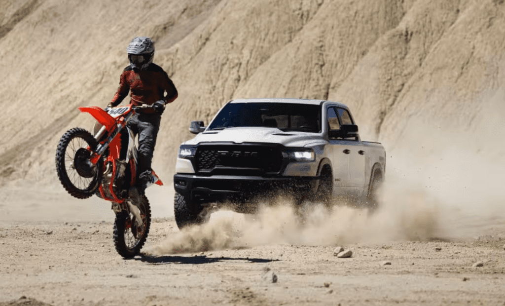 2025 RAM 1500 off-roading with a dirt bike
