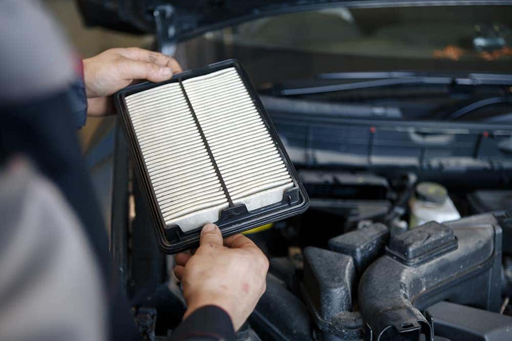 Changing engine air filter as part of Jeep service schedule