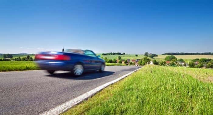 Customer test-driving a high-mileage used car