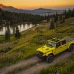 Top-down view of a used Jeep vehicle driving at sunset