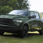 The 2026 RAM 1500 towing a tractor
