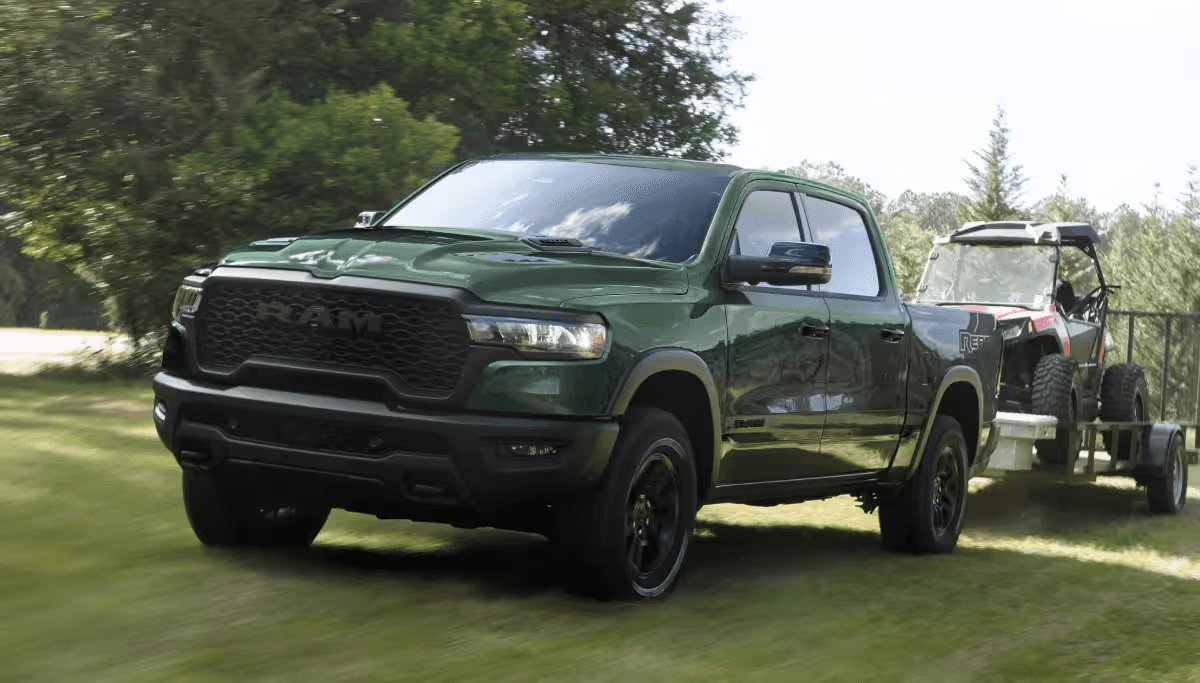 The 2026 RAM 1500 towing a tractor
